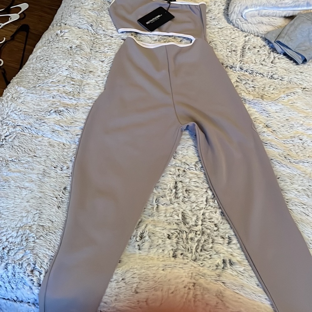 A purple jumpsuit form pretty little thing never worn. Still had tag